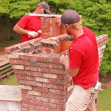 Sweeps rebuild a masonry chimney in Suwanee GA on Lawrenceville Suwanee Rd