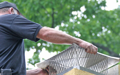 chimney specialists installing chimney cap in woodstock ga