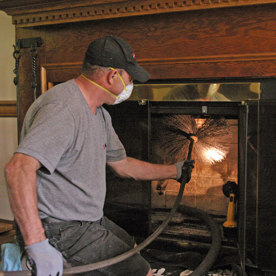 Certified chimney sweep cleaning chimney in Chattanooga, TN and Birmingham, AL.